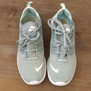 Mint green Nike tennis shoes